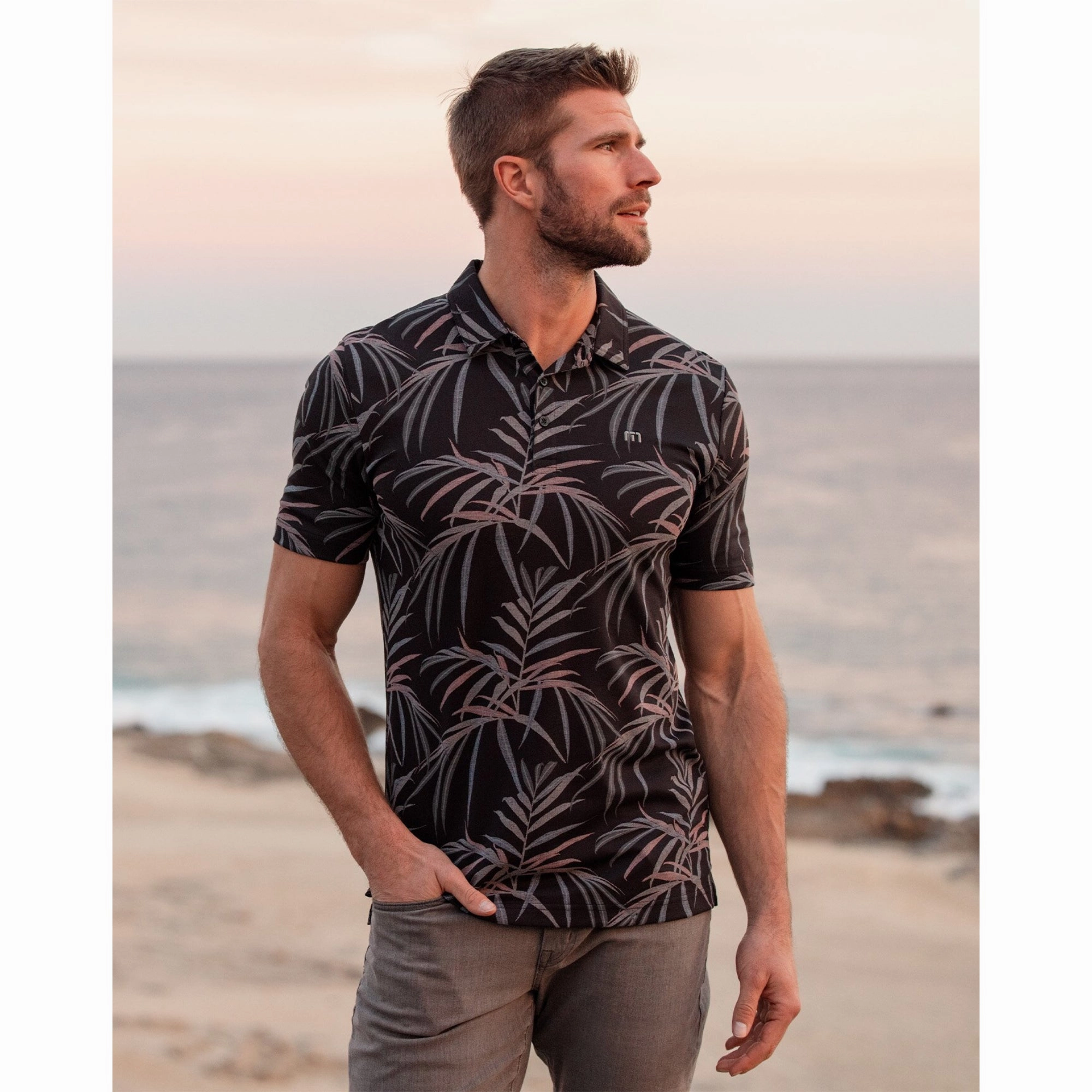 TRAVIS MATHEW MENS BUZZ WORDS POLO - BLACK Travis Mathew Men's Golf Apparel