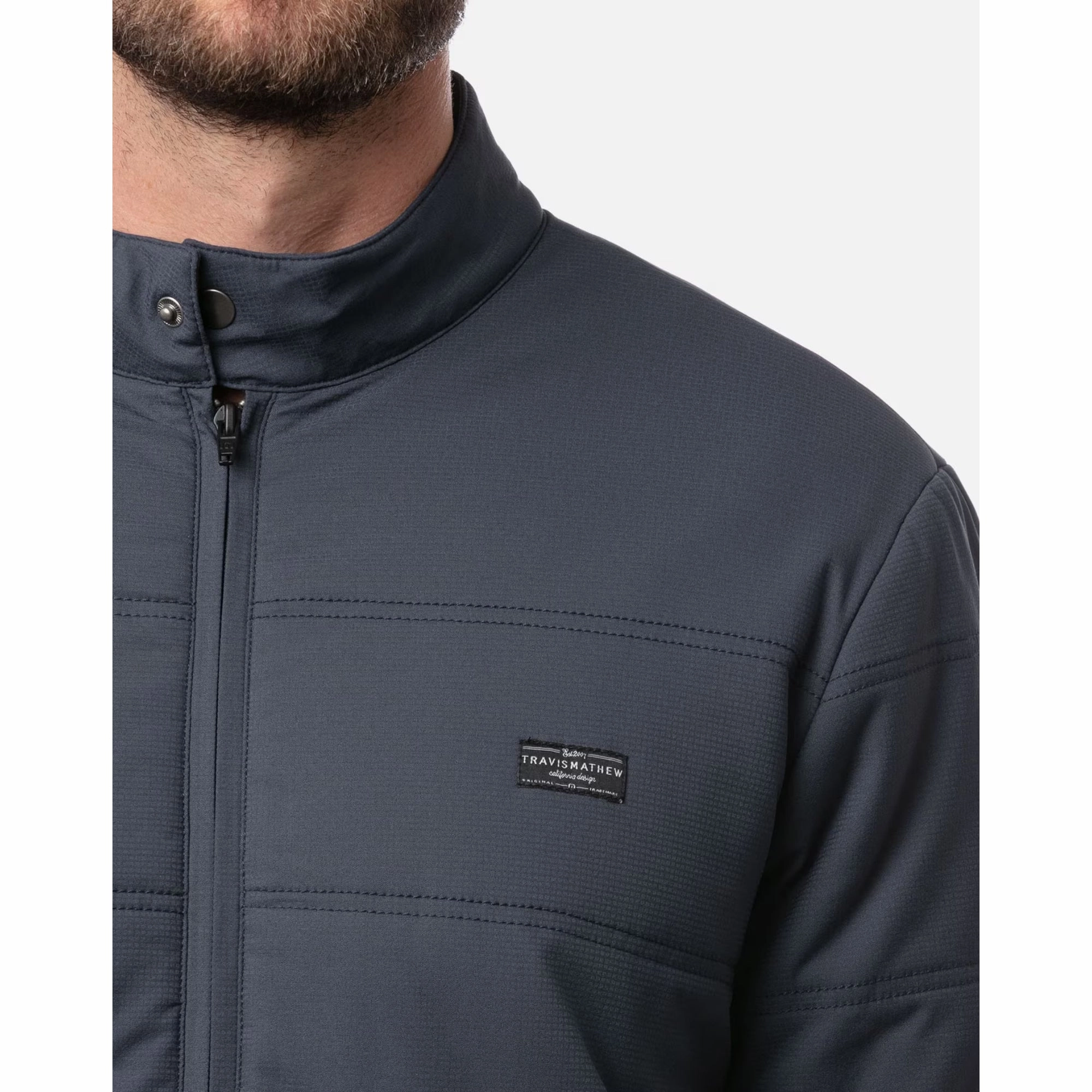 TRAVIS MATHEW MENS INTERLUDE PUFFER JACKET - MOOD INDIGO Travis Mathew Men's Golf Apparel