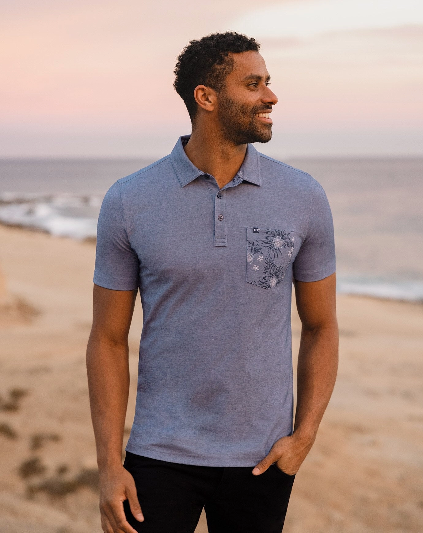 TRAVISMATHEW MENS NO MAPS POLO - HEATHER PEACOAT Travis Mathew Men's Golf Apparel